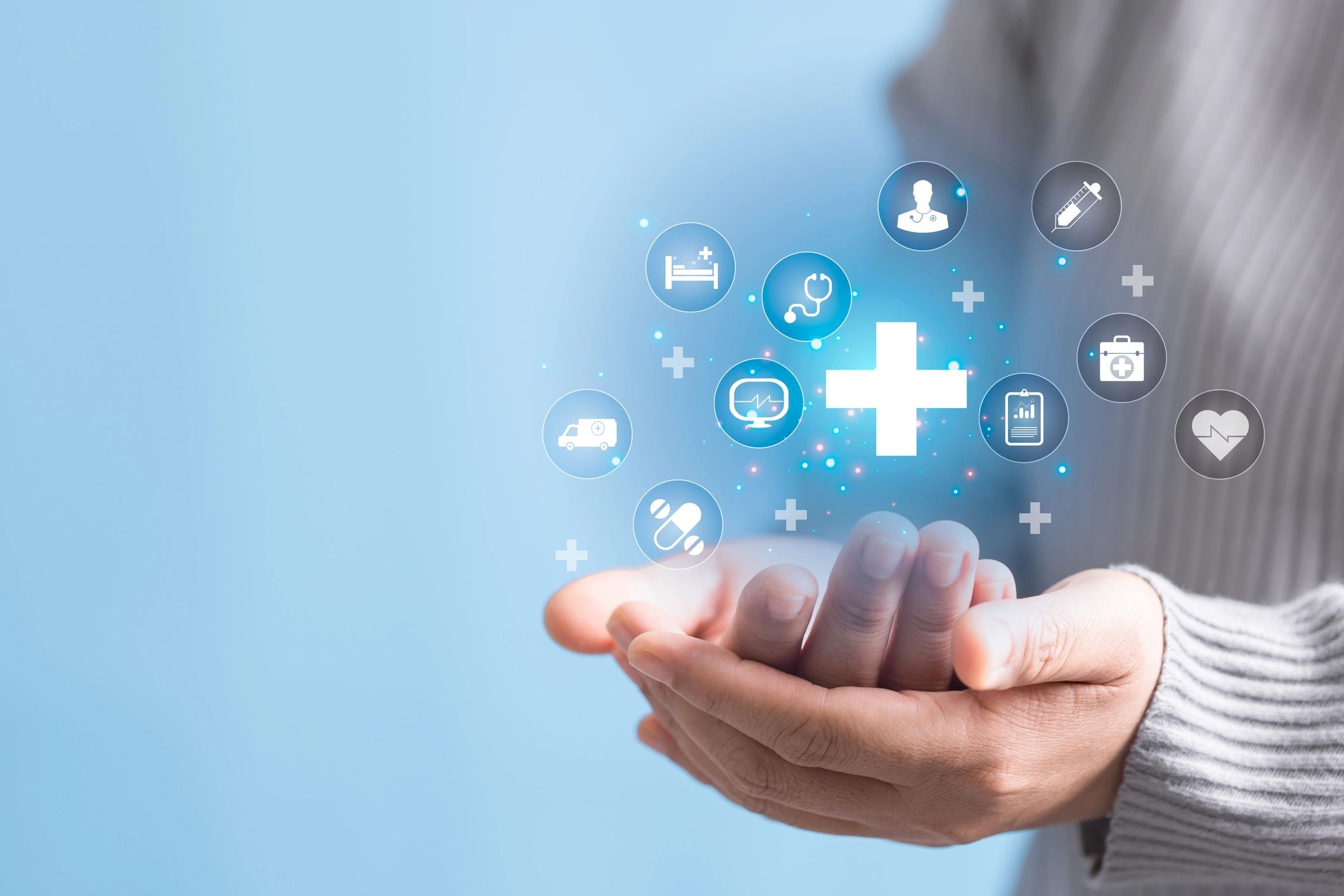 Woman hand holding healthcare icon